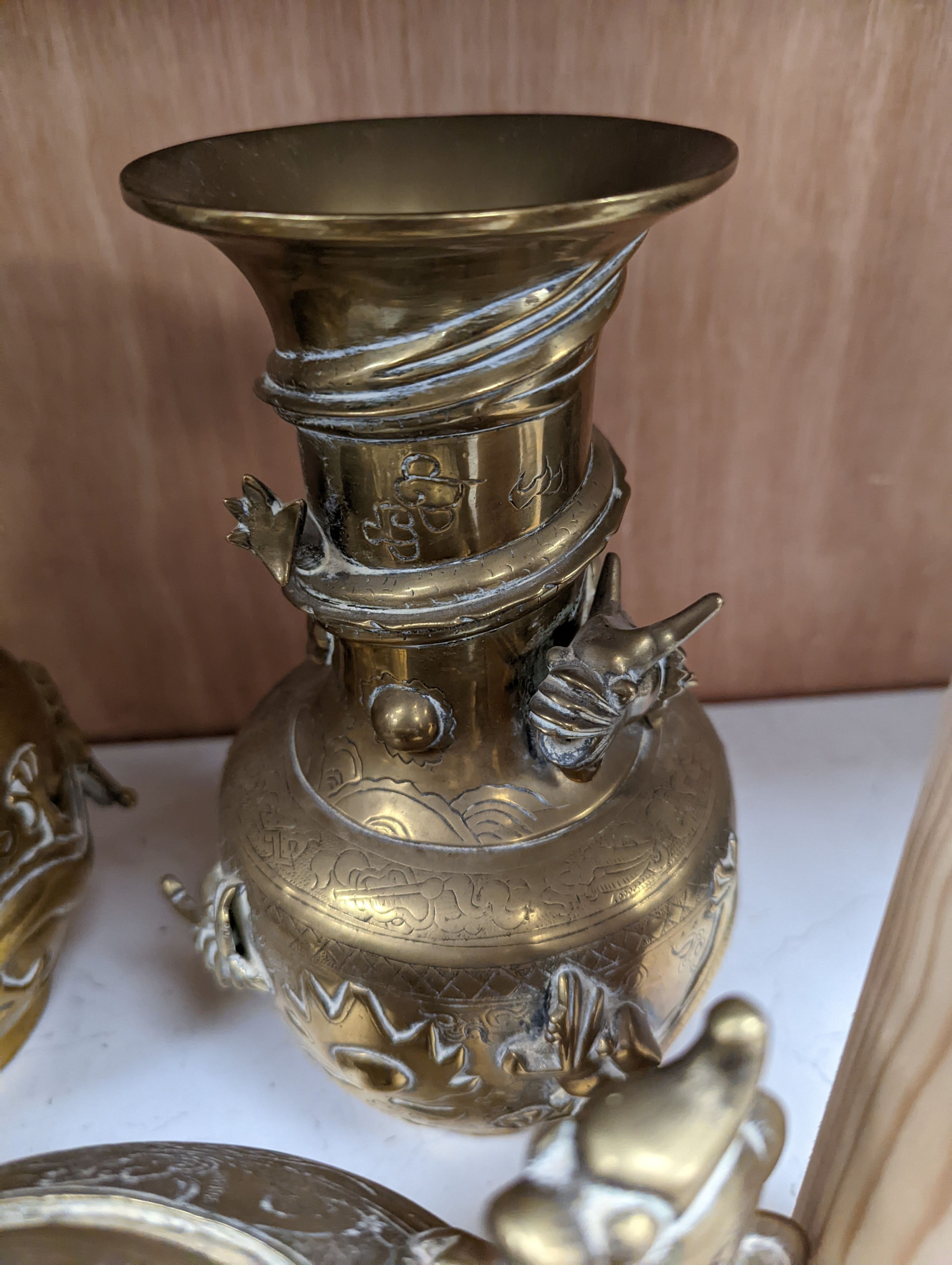 A pair of Chinese brass dragon vases, 26cm, together with two similar incense burners, tallest 30cm high